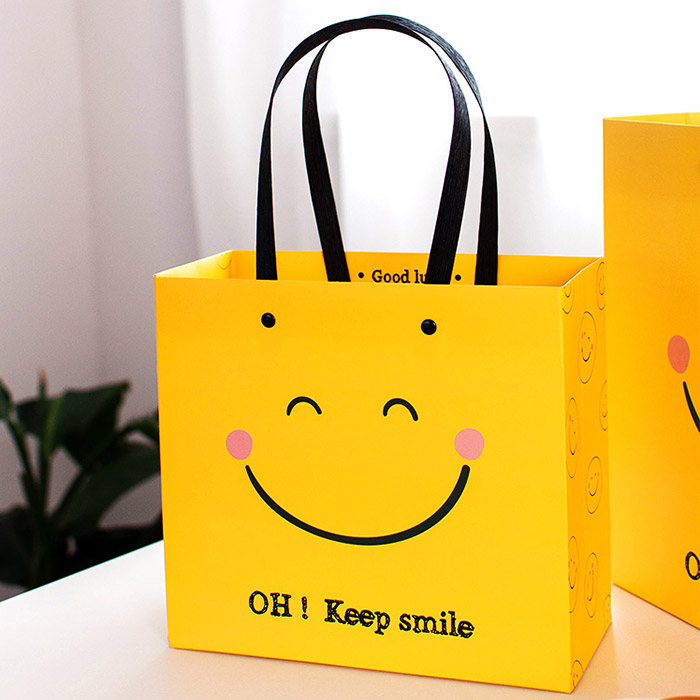 Улыбка сумочка улыбающееся лицо одежда подарочный пакет рождественский мешок маленький бумажный подарочный пакет с вашим собственным логотипом